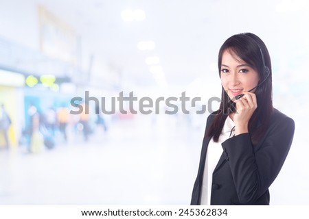 portrait of asian businesswomen has airport background ..Mixed Asian / Caucasian businesswoman.