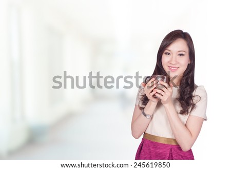 Portrait of young asia business woman 20 -30 year old in her office.Mixed Asian / Caucasian businesswoman.