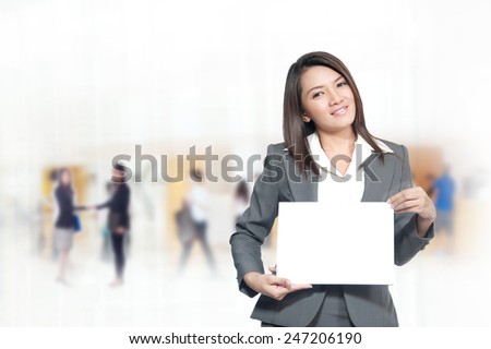 Portrait of young asia business woman 20 -30 year hold banner has space for the words or letters in her office.Mixed Asian / Caucasian businesswoman.Positive emotion