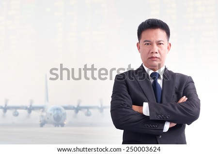 Portrait of young asia businessman with airport background.
