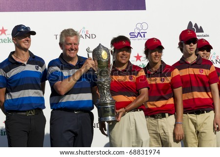 HUA HIN, THAILAND - JANUARY 9: Members of the Europea&Asia team lifting the trophy after winning the Royal Trophy tournament at Black Mountain Golf Club Hua Hin Thailand on January 9, 2011
