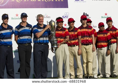 HUA HIN, THAILAND - JANUARY 9: Members of the Europea&Asia team lifting the trophy after winning the Royal Trophy tournament at Black Mountain Golf Club Hua Hin Thailand on January 9, 2011