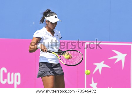 NONTHABURI ,THAILAND - FEB 4 : India tennis player Sania Mirza during her Fed Cup, 2011 World Group Play-Off singles match vs. Noppawan Lertcheewakam,February 4, 2011 in Nonthaburi ,Thailand