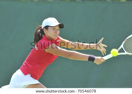 NONTHABURI ,THAILAND - FEB 4 : Korea tennis player Ling Zhang during her Fed Cup, 2011 World Group Play-Off singles match vs. Fatma Ai Nabhani ,February 4, 2011 in Nonthaburi ,Thailand