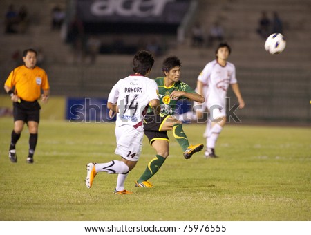 BANGKOK, THAILAND - APRIL 24: A.Noichuenpan(green) in action during Thai Premier League (TPL) between Army Utd. (green) vs Insee Police Utd. (white) on April 24, 2011 at Army Stadium in Bangkok Thailand
