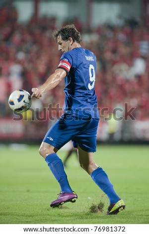 NONTHABURI THAILAND- MAY 10 : A.Duric (blue) in action during the AFC CUP Group G between Muang Thong UTD vs Tampines Rovers Fc on May 10, 2011 at Yamaha Stadium in Nonthaburi, Thailand
