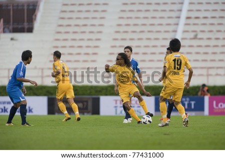 BANGKOK, THAILAND - MAY 17: E.Davids (yellow) in action during Thailand-Japan Stars Charity Match between Stars Thailand (Blue) vs Stars Japan (yellow) on May 17, 2011 at Supachalasia Stadium in Bangkok,Thailand.