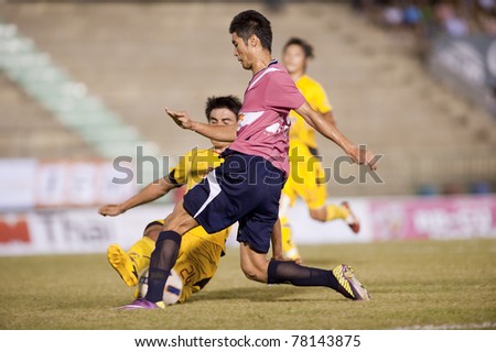 BANGKOK, THAILAND- MAY 28: C.Tatong (R) in action during Thai Premier League (TPL) Divition 1 between BB-CU Fc (P) vs Cat Today Janburi (Y) on May 28, 2011 at Army Stadium in Bangkok, Thailand