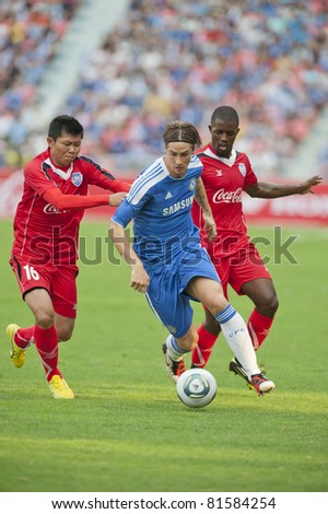 BANGKOK - JULY 24 : F.Torres (B) in action during Coke Super Cup : Chelsea  Asia Tour 2011 (Thailand),  between Chelsea vs Thail  All-Star on July 24, 2011 in Rajamangla Stadium,Bangkok, Thailand.