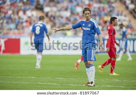 BANGKOK - JULY 24 : F.Torres (B) in action during Coke Super Cup : Chelsea  Asia Tour 2011 (Thailand),  between Chelsea vs Thail  All-Star on July 24, 2011 in Rajamangla Stadium, Bangkok, Thailand.