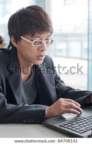 Portrait of Asia businessman working in various poses.