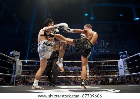 BANGKOK, THAILAND- SEPTEMBER 25 : Unidentified boxers compete in Thai Fight:Muay Thai World's Unrivaled Fight on September 25, 2011 at Thammasat University Convention Center in Bangkok, Thailand