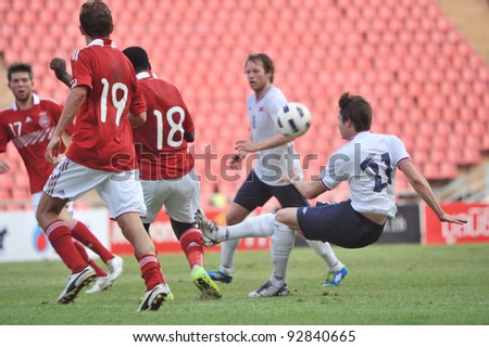 BANGKOK THAILAND - JANUARY 15 : A.Lucas (L) in action during KING\'S CUP 2012 between Denmark vs Norway on January 15, 2012 in Rajamangla Stadium,Bangkok, Thailand.