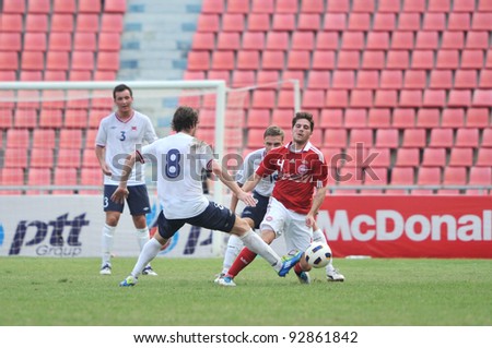 BANGKOK THAILAND - JANUARY 15 : C.Soeren (R) in action during KING\'S CUP 2012 between Denmark vs Norway on January 15, 2012 in Rajamangla Stadium,Bangkok, Thailand.