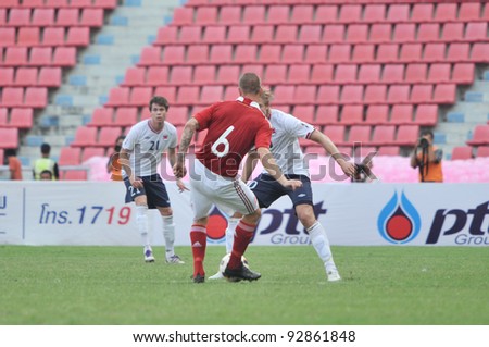 BANGKOK THAILAND - JANUARY 15 : F.Dennis in action during KING\'S CUP 2012 between Denmark vs Norway on January 15, 2012 in Rajamangla Stadium,Bangkok, Thailand.
