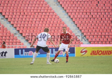 BANGKOK THAILAND - JANUARY 15 : F.Dennis (R) in action during KING\'S CUP 2012 between Denmark vs Norway on January 15, 2012 in Rajamangla Stadium,Bangkok, Thailand.