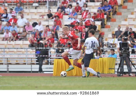 BANGKOK THAILAND - JANUARY 15 : C.Makinok (L) in action during KING\'S CUP 2012 between Denmark vs Norway on January 15, 2012 in Rajamangla Stadium,Bangkok, Thailand.