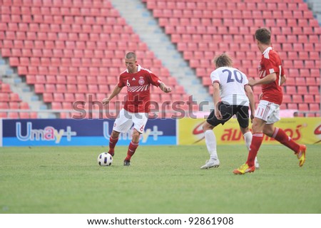 BANGKOK THAILAND - JANUARY 15 : F.Dennis (L) in action during KING\'S CUP 2012 between Denmark vs Norway on January 15, 2012 in Rajamangla Stadium,Bangkok, Thailand.