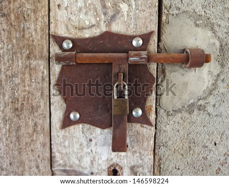 first plane of an iron bolt in a wooden door