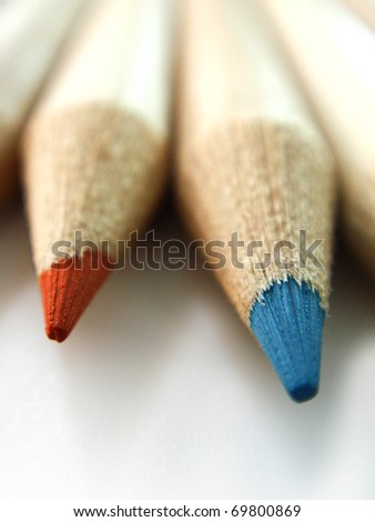 first plane of the tip of pencils of colors on white bottom