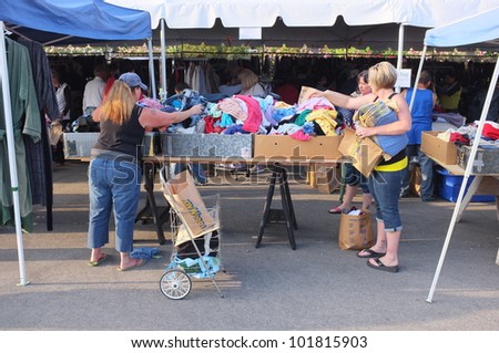 BAKERSFIELD, CA - MAY 4: Many people turn out to eye merchandise and shop for bargains at the 