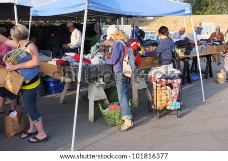 BAKERSFIELD, CA - MAY 4: Many people turn out to eye merchandise and shop for bargains at the 