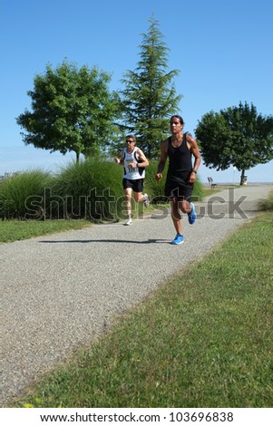 BAKERSFIELD, CA - MAY 26:  Two unidentified male contestants find the pace fast and the weather hot during the Running Xrew Invite 5k race on May 26, 2012, at Bakersfield, California.