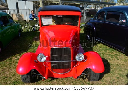 BAKERSFIELD, CA-MAR 2: A very red custom 1929 Ford Model A makes a bold statement at the Cruisin\' For A Wish Car & Motorcycle Show on March 2, 2013, in Bakersfield, California