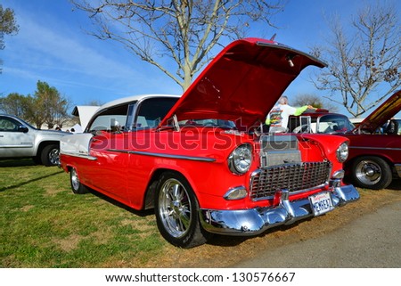 BAKERSFIELD, CA-MAR 2: A 1955 Chevrolet Bel Air shows off its chromed engine parts at the Cruisin\' For A Wish Car & Motorcycle Show on March 2, 2013, in Bakersfield, California.