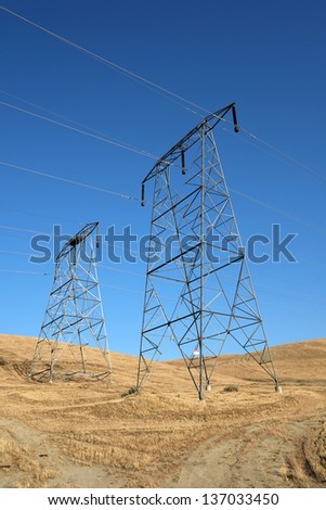 High voltage transmission lines and their supporting steel towers carry electricity to Central California customers