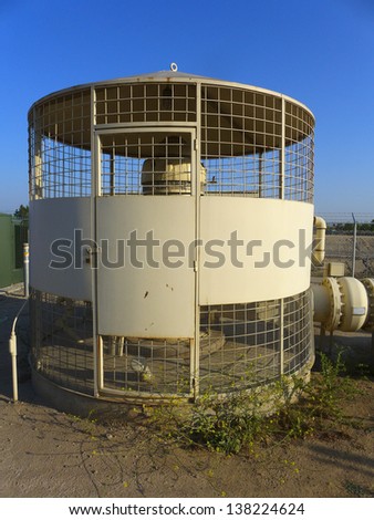 The vertical turbine pump and round enclosure of an irrigation water pumping facility
