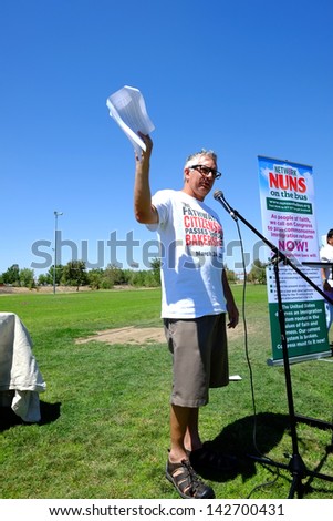 BAKERSFIELD, CA-JUN 15: Nick Velardes speaks to the crowd before the march to Congressman Kevin McCarthy\'s office in support of a new immigration law on June 15, 2013, in Bakersfield, California.