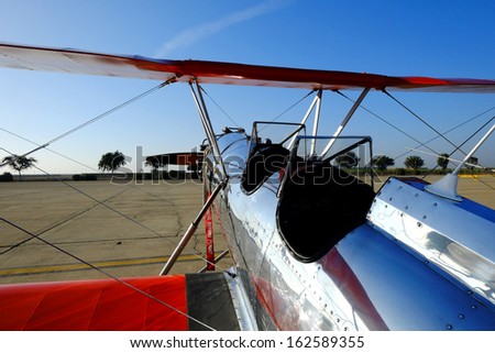SHAFTER, CA - NOV 2: A vintage Myers Biplane sports a shiny aluminum fuselage and lots of wing area at the Minter Field Fly-In on Nov 2, 2013, at Shafter, California.