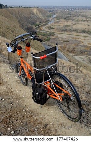 BAKERSFIELD, CA -  FEB 17, 2014: The long wheelbase Easy Racers Gold Rush recumbent bicycle is a human-powered alternative transportation solution for commuting to the office or touring the country.
