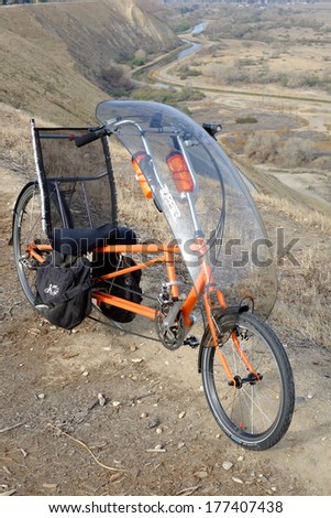 BAKERSFIELD, CA -  FEB 17, 2014: The long wheelbase Easy Racers Gold Rush recumbent bicycle is a human-powered alternative transportation solution for commuting to the office or touring the country.