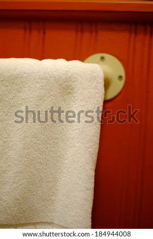 Background or texture: White bath towel on wall-mounted rack in Victorian house