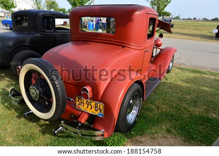BAKERSFIELD, CA-APRIL 19, 2014: A sporty 1930 Chevrolet with only primer paint is on display at the Cruisin\' For A Wish Car & Motorcycle Show.