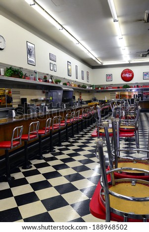 BAKERSFIELD, CA - APR 22, 2014: The floor is cleaned and chairs ready to be put down to await customers at this classic lunch counter still in service in a former F. W. Woolworth building.