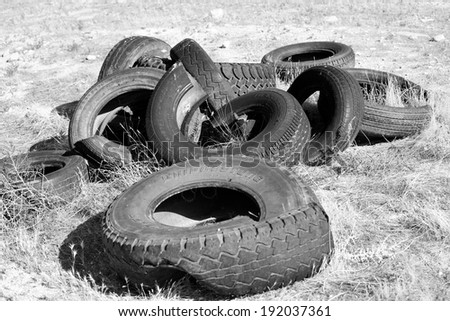 BAKERSFIELD, CA - APRIL 7, 2014: Illegal dumping of used tires has created an eyesore and needless expense for the land owner as well as environmental challenges.
