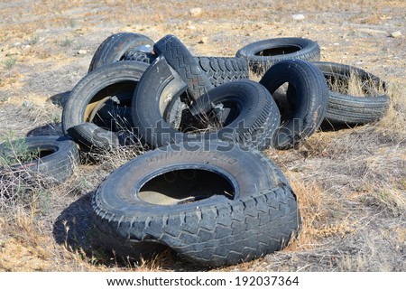 BAKERSFIELD, CA - APRIL 7, 2014: Illegal dumping of used tires has created an eyesore and needless expense for the land owner as well as environmental challenges.