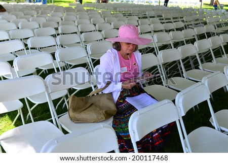 DELANO, CA-JUNE 21, 2014: The 40th Anniversary Celebration at Agbayani Village: Mary McCartney arrives early and takes a seat under the big tent to await the speakers.