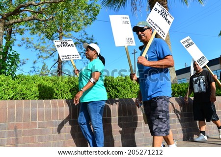 BAKERSFIELD, CA-JULY 15, 2014: After six months failed negotiations the teamsters union strikes the Golden Empire Transit District. Union members walk the picket line in the extreme heat.