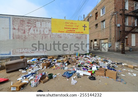 BAKERSFIELD, CA - FEBRUARY 20, 2015: The homeless, with nowhere to dispose of trash or conduct normal activities, add to the urban blight of the inner city.
