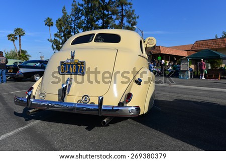 BAKERSFIELD, CA - APR 11, 2015: A 1939 Studebaker Commander is displayed today at the Calvary Baptist Church Spring Car Show. This sedan has fender skirts and even a side-mounted water cooler.