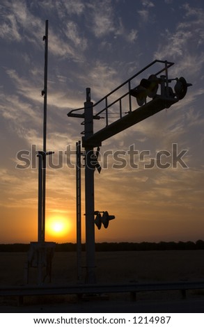 Railroad signal at sunrise