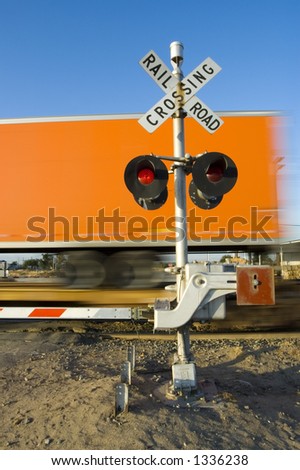 Fast freight at grade crossing