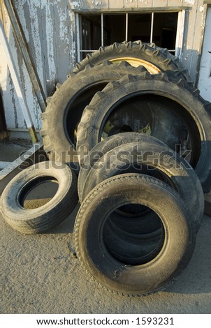 Tractor tires in various stages of repair at a country tire store