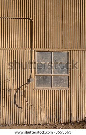 Weathered window of old shop building showing wear
