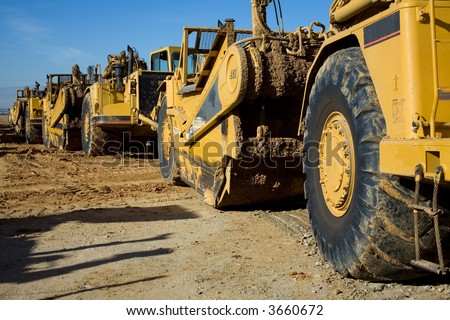 Heavy equipment is lined up on a major construction job site