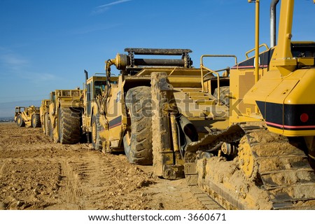 Heavy equipment is lined up on a major construction job site